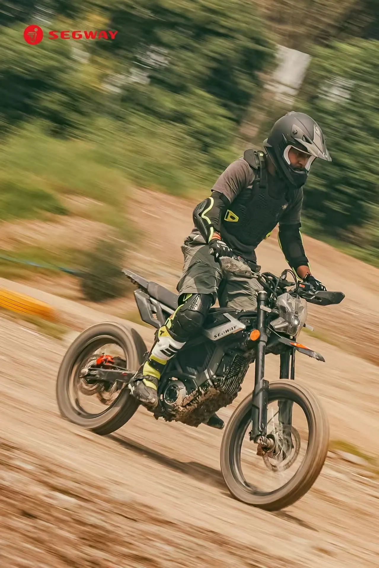 Raj riding a Segway Xaber on a muddy motocross track