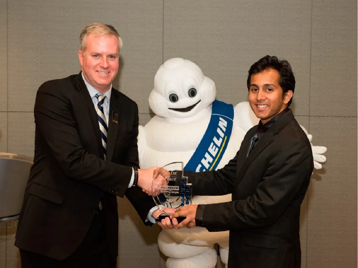 Raj receiving the Michelin Challenge Design award